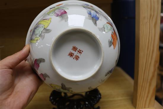A Chinese famille rose bowl, Qianlong mark but early 20th century diameter 17.5cm, wood stand